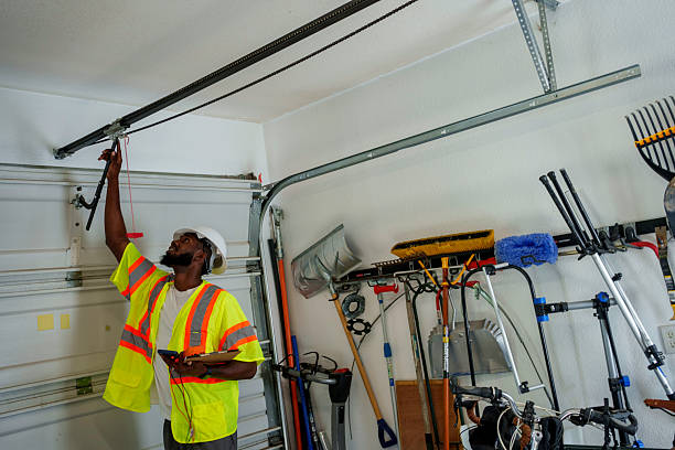 Professional Garage Door Panel Replacement technician working in Rainier, OR